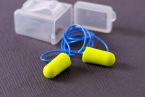 A pair of foam ear plugs with case.