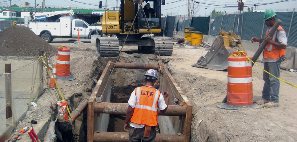 MTA Capital Construction setting a trench box at excavation for duct bank at manhole e-2.