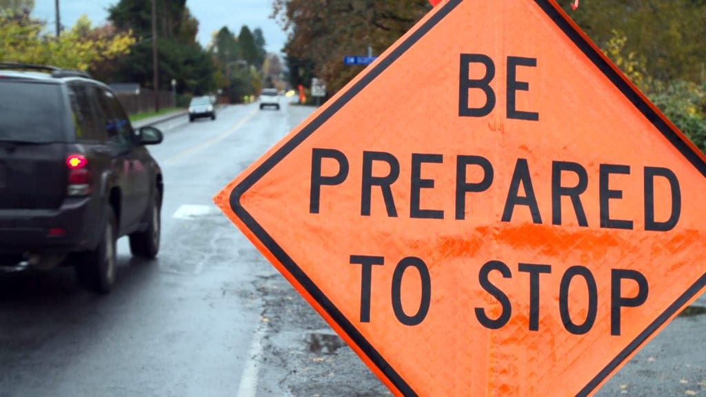 A temporary traffic control sign that reads, “Be prepared to stop”.