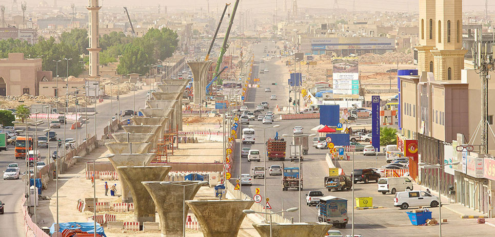 Cranes over a public transportation construction site in Riyadh, Saudi Arabia.